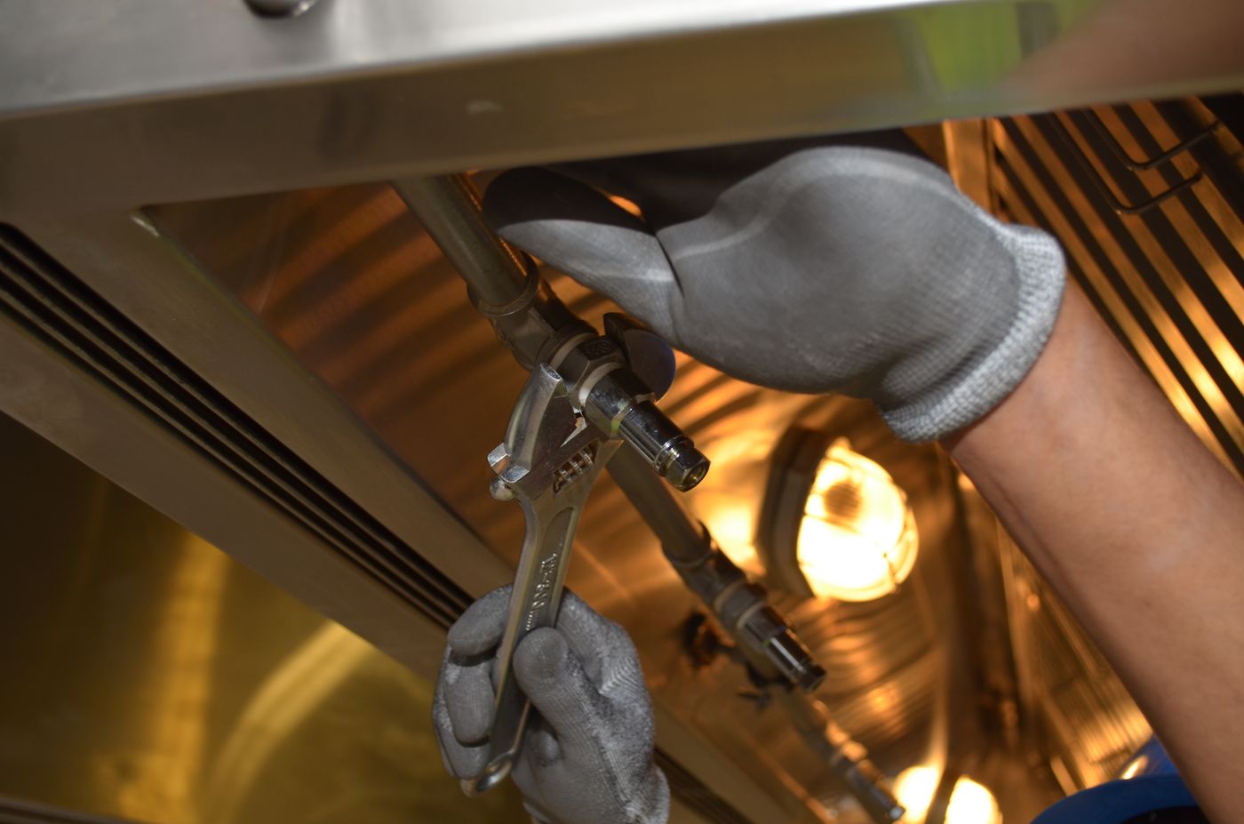 Tightening a fitting with a wrench
